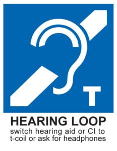 Blue sign. At top: International Symbol of Access for Hearing Loss. Bottom, black on white background "switch hearing aid or CI to t-coil or ask for headphones"