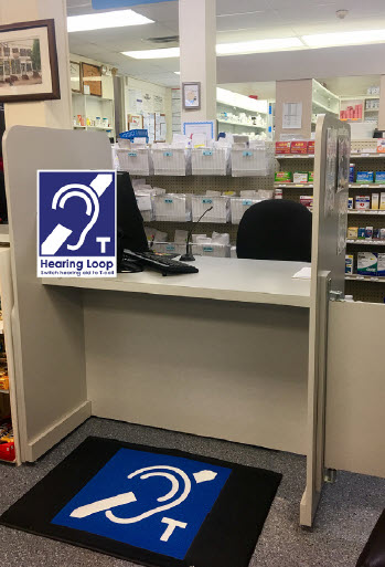 Hearing loop floor mat at pharmacy counter, photo credit: Audio Directions