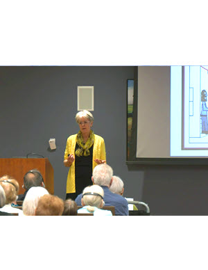 photo of Dr. Sterkens in front of audience giving the presentation