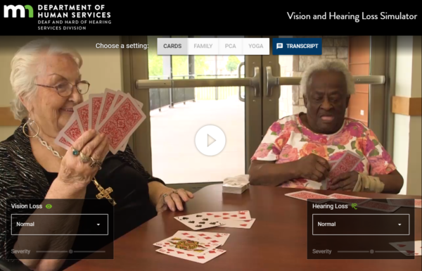 screenshot of video, with two women playing cards. State of Minnesota logo at the top of the screen