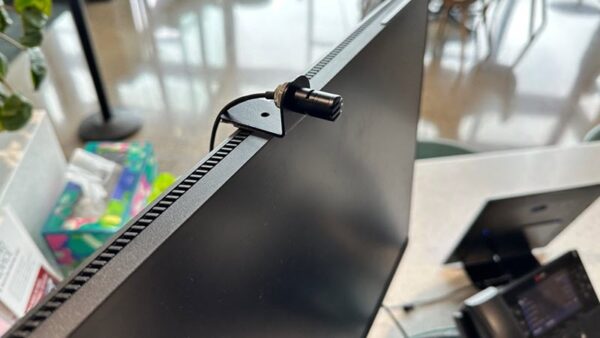 computer screen with small microphone affixed to the top of the screen