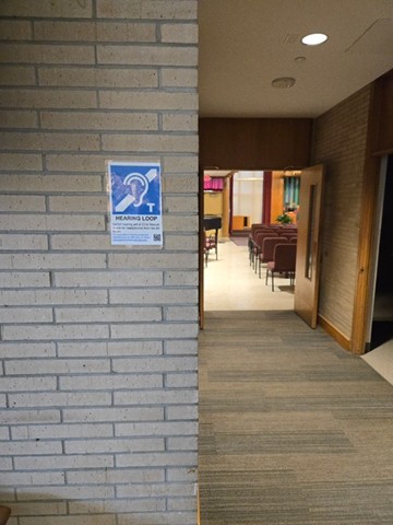 photo of sign in hallway outside of church sanctuary