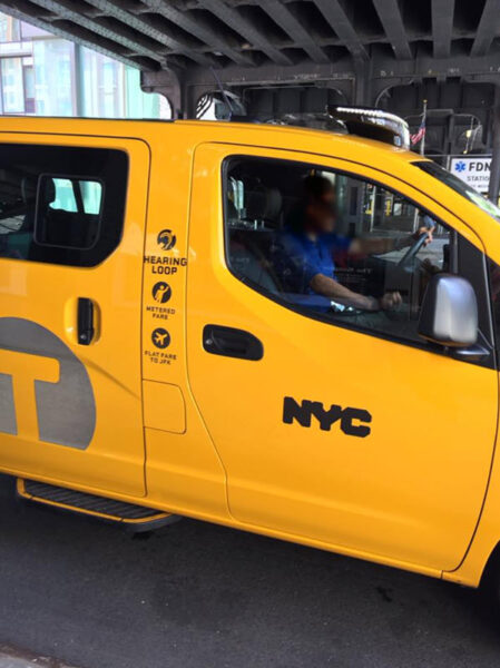 New York City Taxi with hearing loop symbol on outside